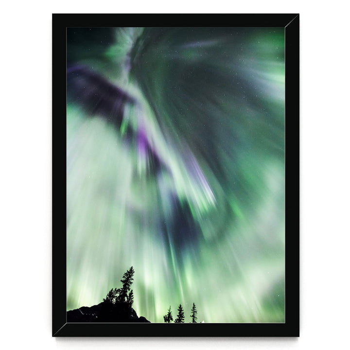 a stunning display of the northern lights, also known as the aurora borealis, illuminating the night sky with vibrant green and purple hues.