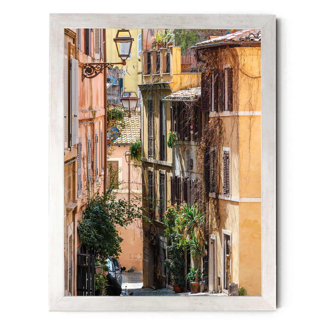 a narrow, colorful street lined with buildings and lush greenery, creating a vibrant and charming atmosphere.