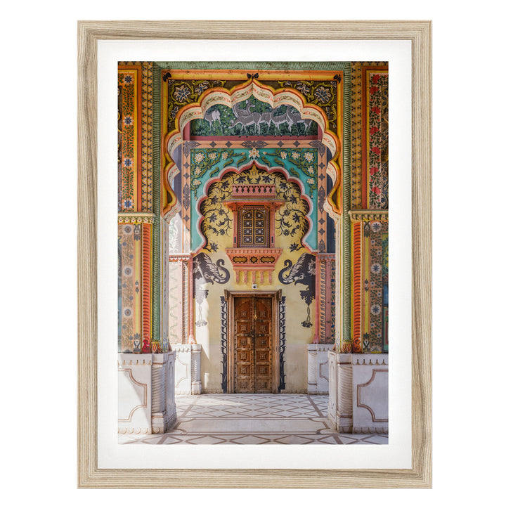 a colorful and ornate doorway with intricate patterns and designs, including arches, columns, and a wooden door.