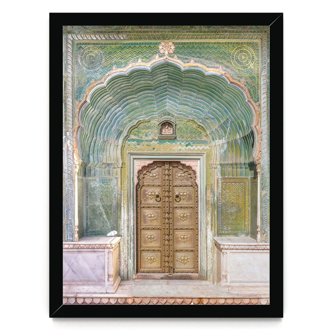 a large, ornate golden door with intricate carvings and patterns, set within an elaborate archway.