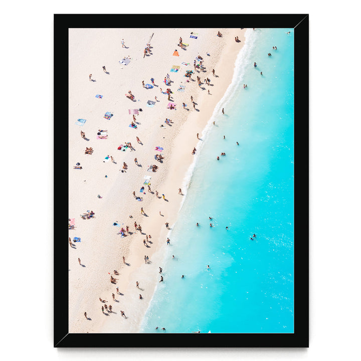 a crowded beach with people enjoying the sun and sand, with the ocean visible in the background.