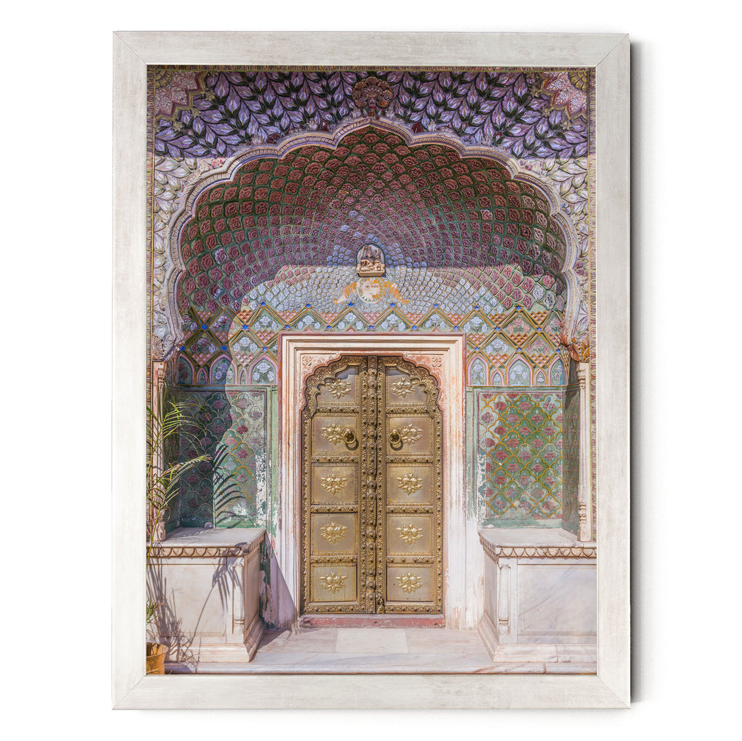 a beautifully decorated doorway with intricate patterns and designs, including a large archway and ornate golden doors.