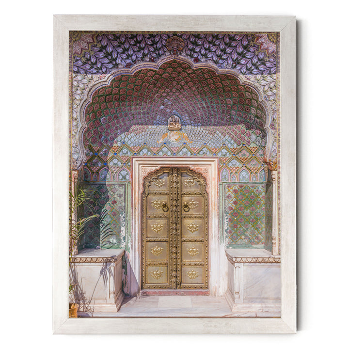a beautifully decorated doorway with intricate patterns and designs, including a large archway and ornate golden doors.