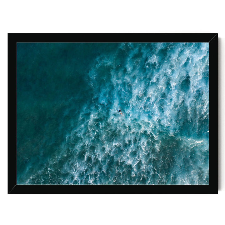 a surfer riding a large, powerful wave in the ocean.