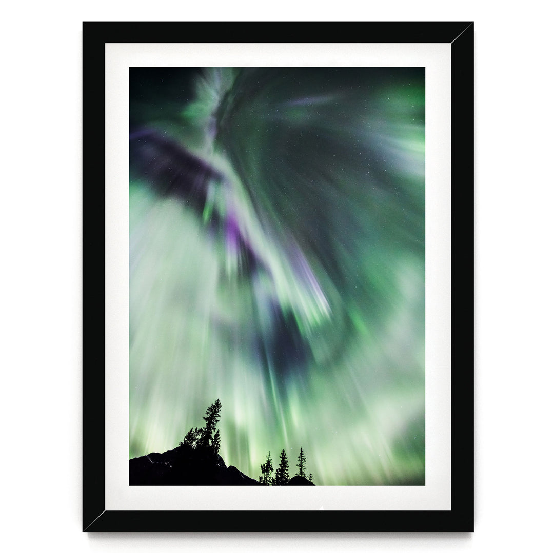 a stunning display of the northern lights, with vibrant green and purple hues swirling across the night sky.