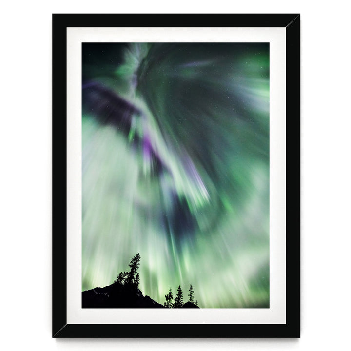a stunning display of the northern lights, with vibrant green and purple hues swirling across the night sky.