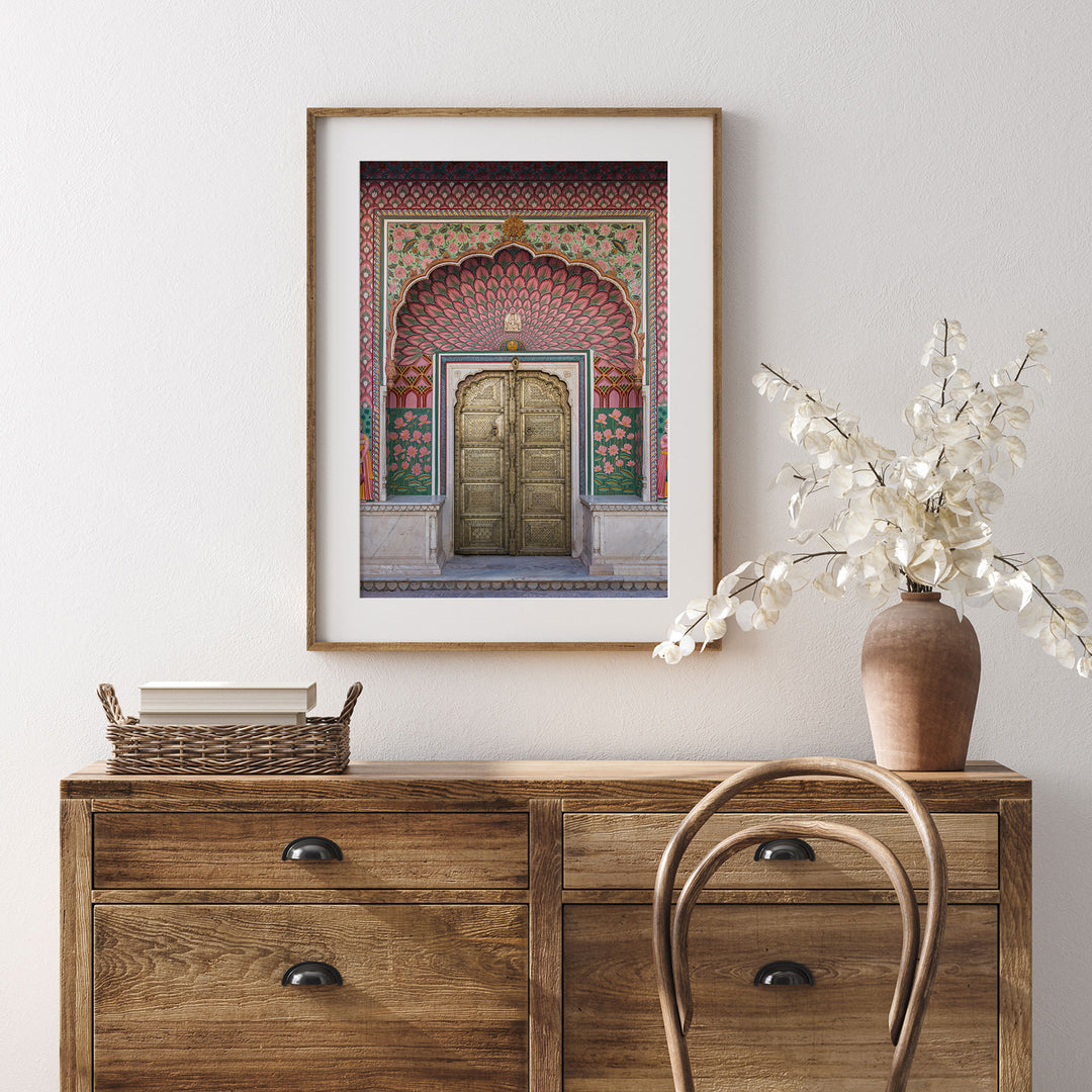 a picture of a wooden cabinet with a vase of flowers on top of it