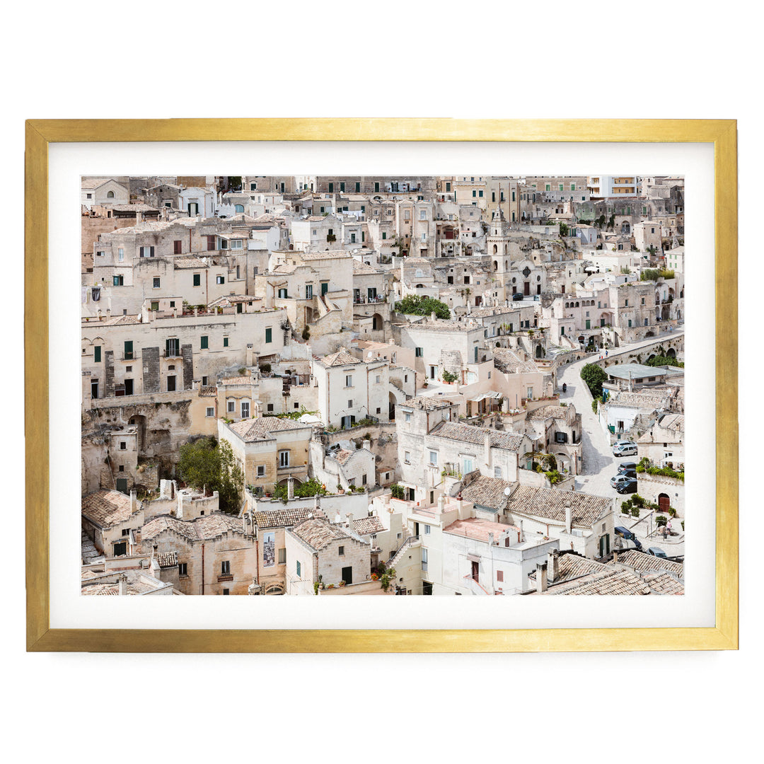 The image is a panoramic view of a densely populated city with numerous buildings and structures, showcasing the architectural diversity and layout of the urban environment.