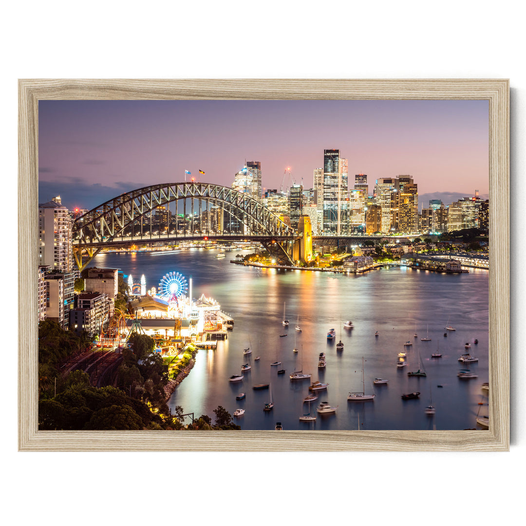 a city skyline at night, with a large bridge spanning a river filled with boats. The city is illuminated by the lights of the buildings, creating a vibrant and lively atmosphere.