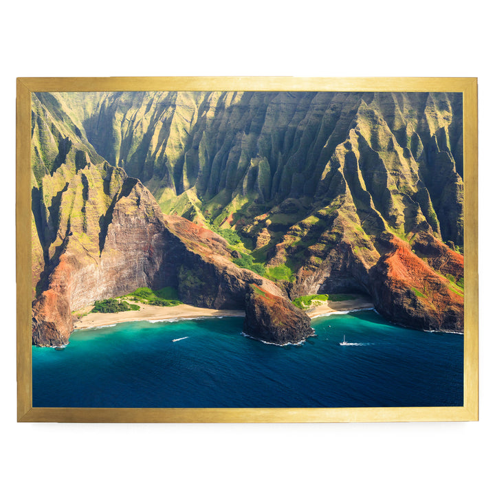 a stunning coastal landscape with towering cliffs, a deep blue ocean, and a sandy beach.