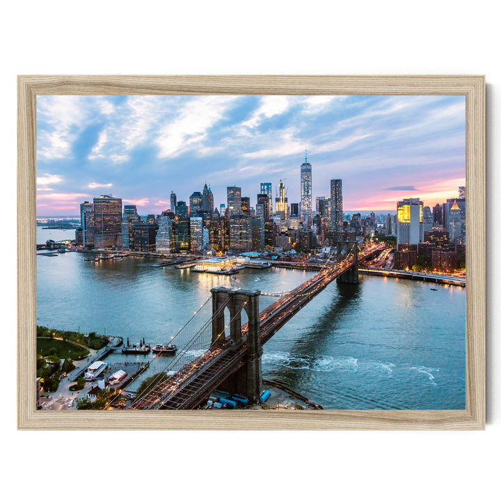 a cityscape with a bridge spanning a large body of water, surrounded by tall buildings and skyscrapers. The sky is filled with clouds, creating a dramatic backdrop for the city's skyline.