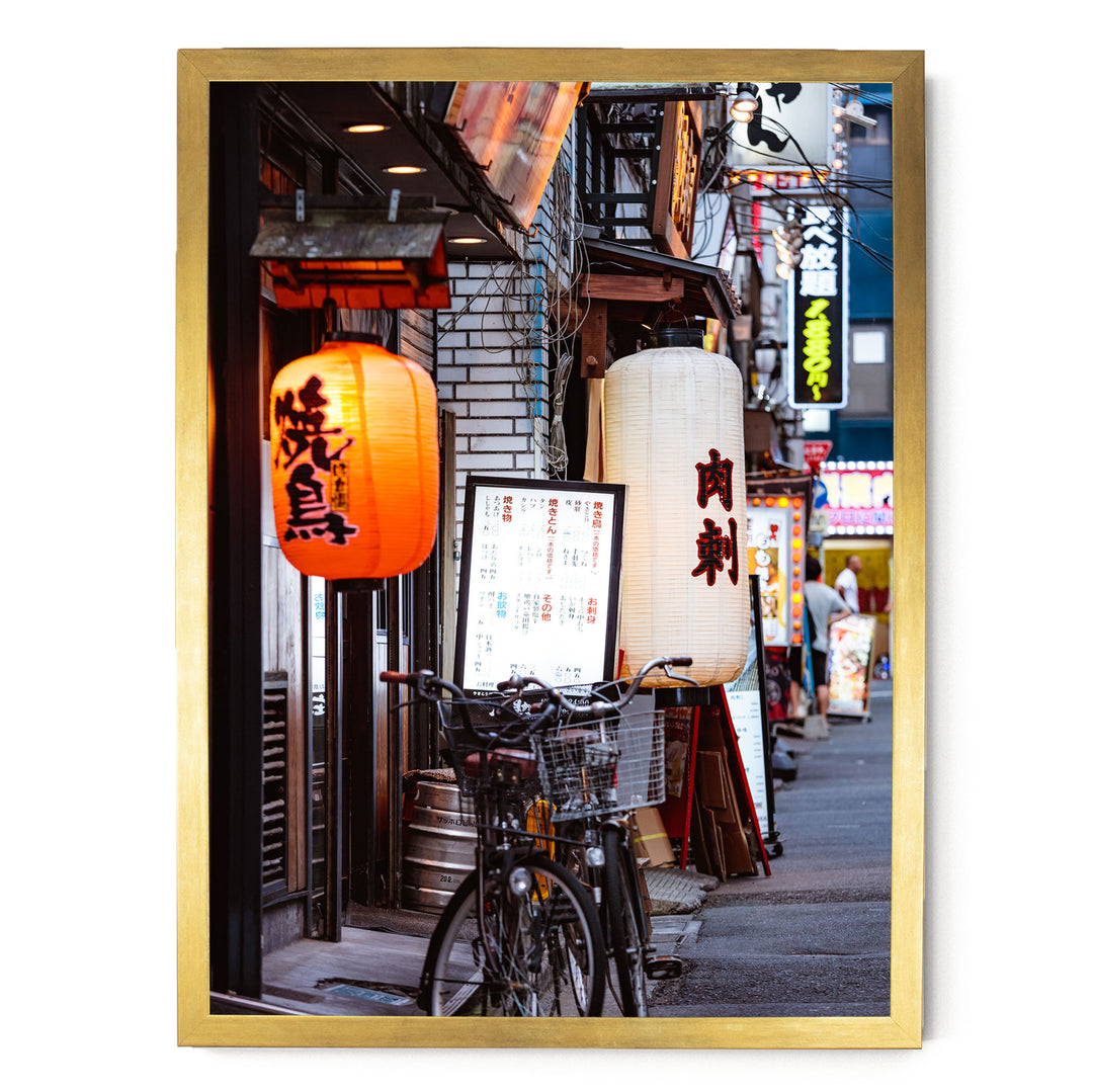 a vibrant street scene in Japan, with colorful lanterns hanging from the buildings and a bicycle parked on the sidewalk.