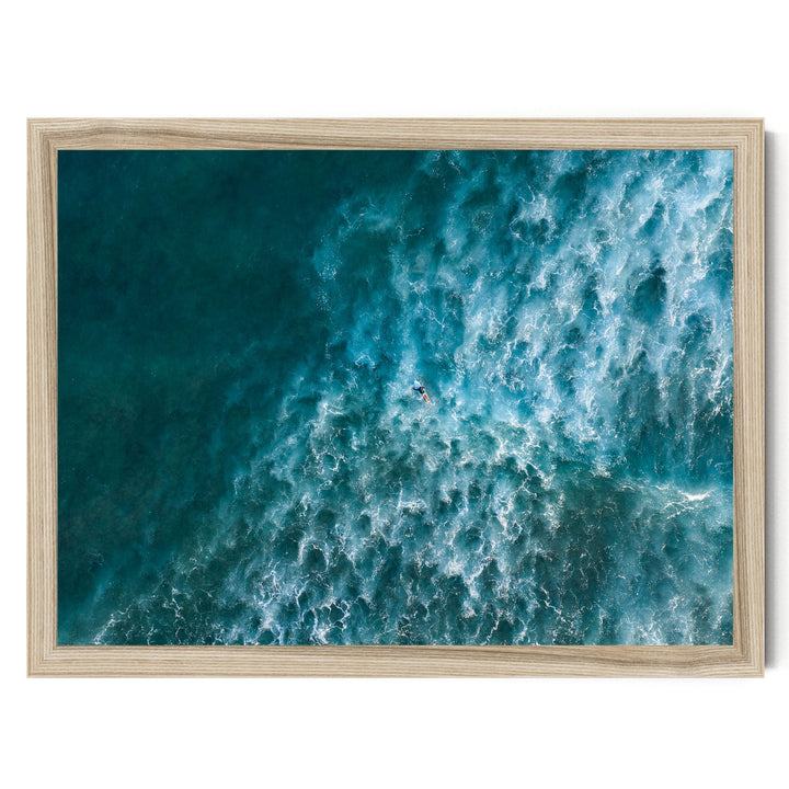 a surfer riding a large, powerful wave in the ocean.