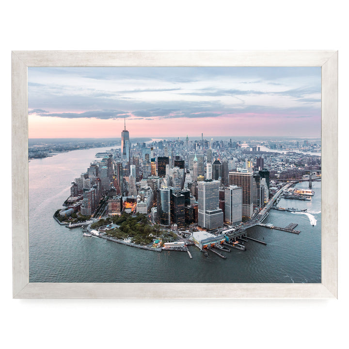 The image is an aerial view of the New York City skyline, showcasing the city's iconic skyscrapers and waterfront.