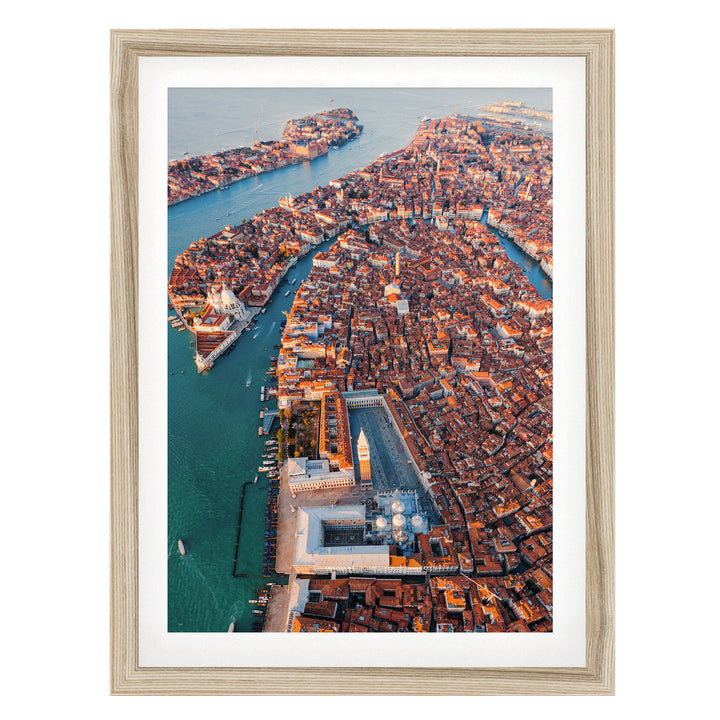 An aerial view of the city of Venice, Italy, showcasing its iconic canals, domes, and buildings.