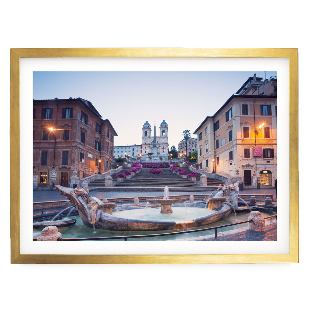 a picturesque scene of a fountain surrounded by ornate buildings, with a church tower visible in the background.