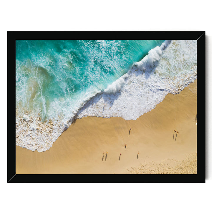 a serene beach scene with a large wave crashing onto the sandy shore, where a group of people are walking along the beach.