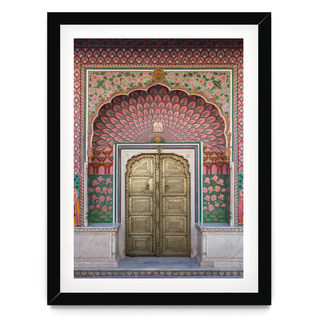 a large, ornate golden door with intricate designs and patterns, set within a colorful, decorative archway.