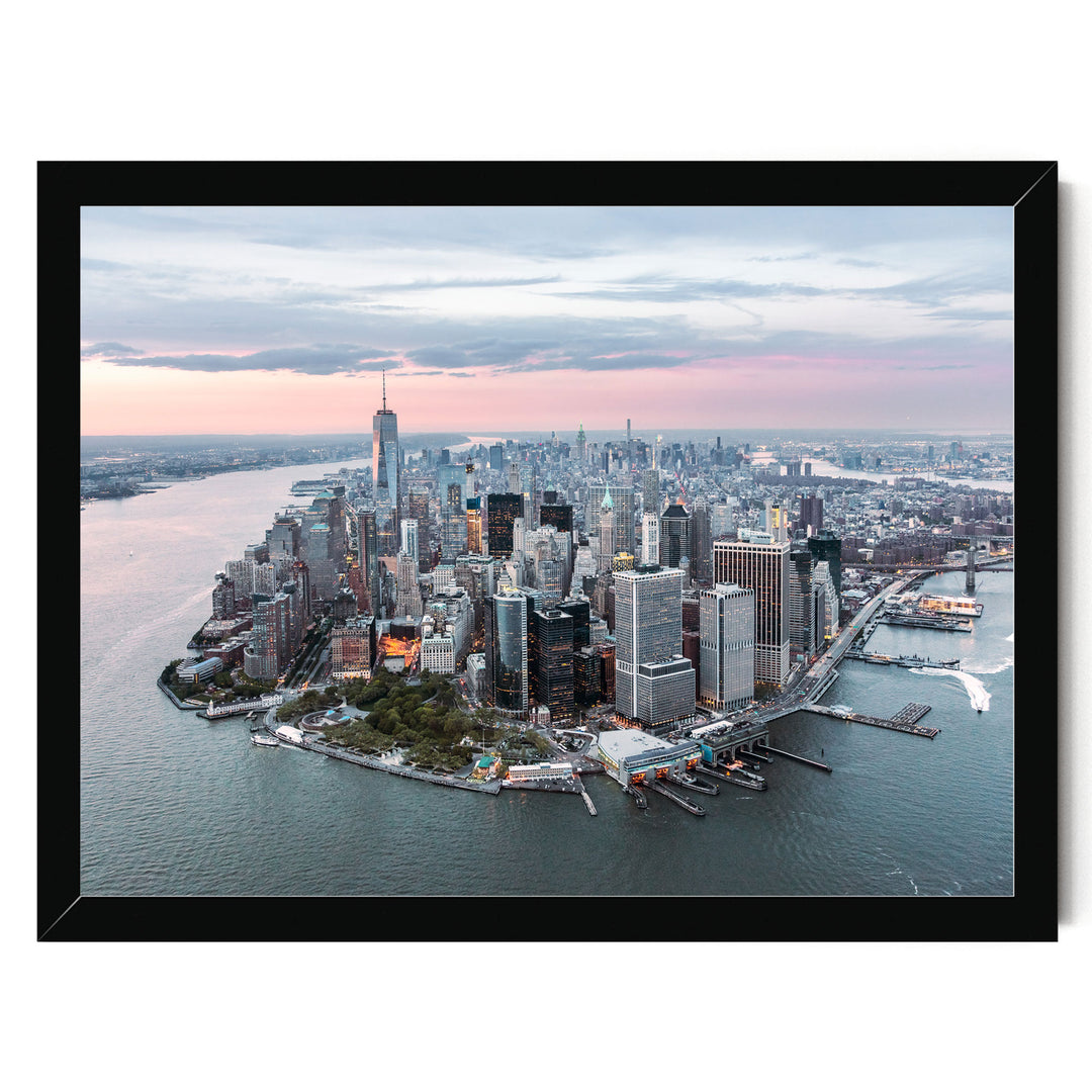 The image is an aerial view of the New York City skyline, showcasing the city's iconic skyscrapers and waterfront.