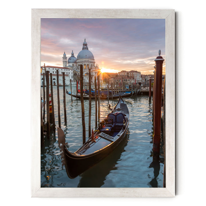 a serene scene of a gondola floating on the water, with a picturesque view of the Grand Canal in Venice, Italy, and the iconic St. Mark's Basilica in the background.