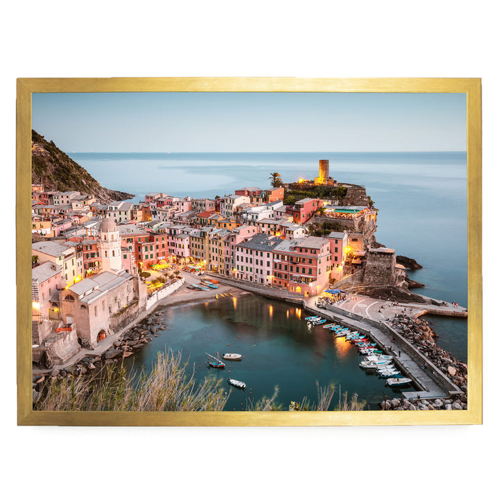 a picturesque coastal town with colorful buildings, a harbor filled with boats, and a lighthouse on a cliff overlooking the water.