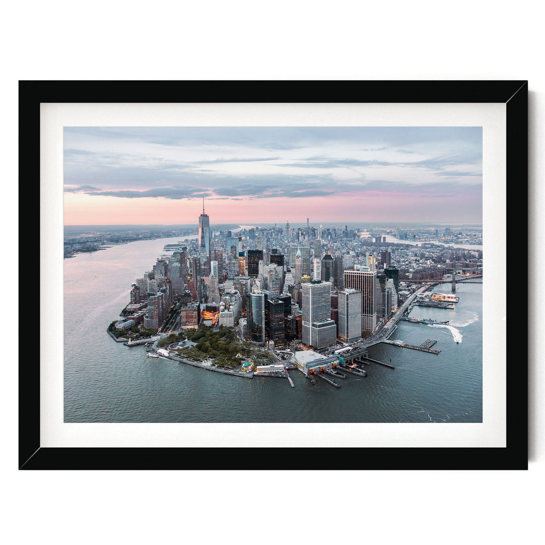 An aerial view of the New York City skyline, showcasing the iconic skyscrapers and the surrounding waterways.