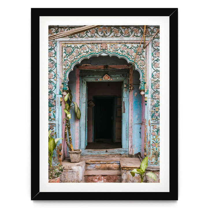 a colorful, ornately decorated doorway with a wooden frame, featuring intricate patterns and designs.
