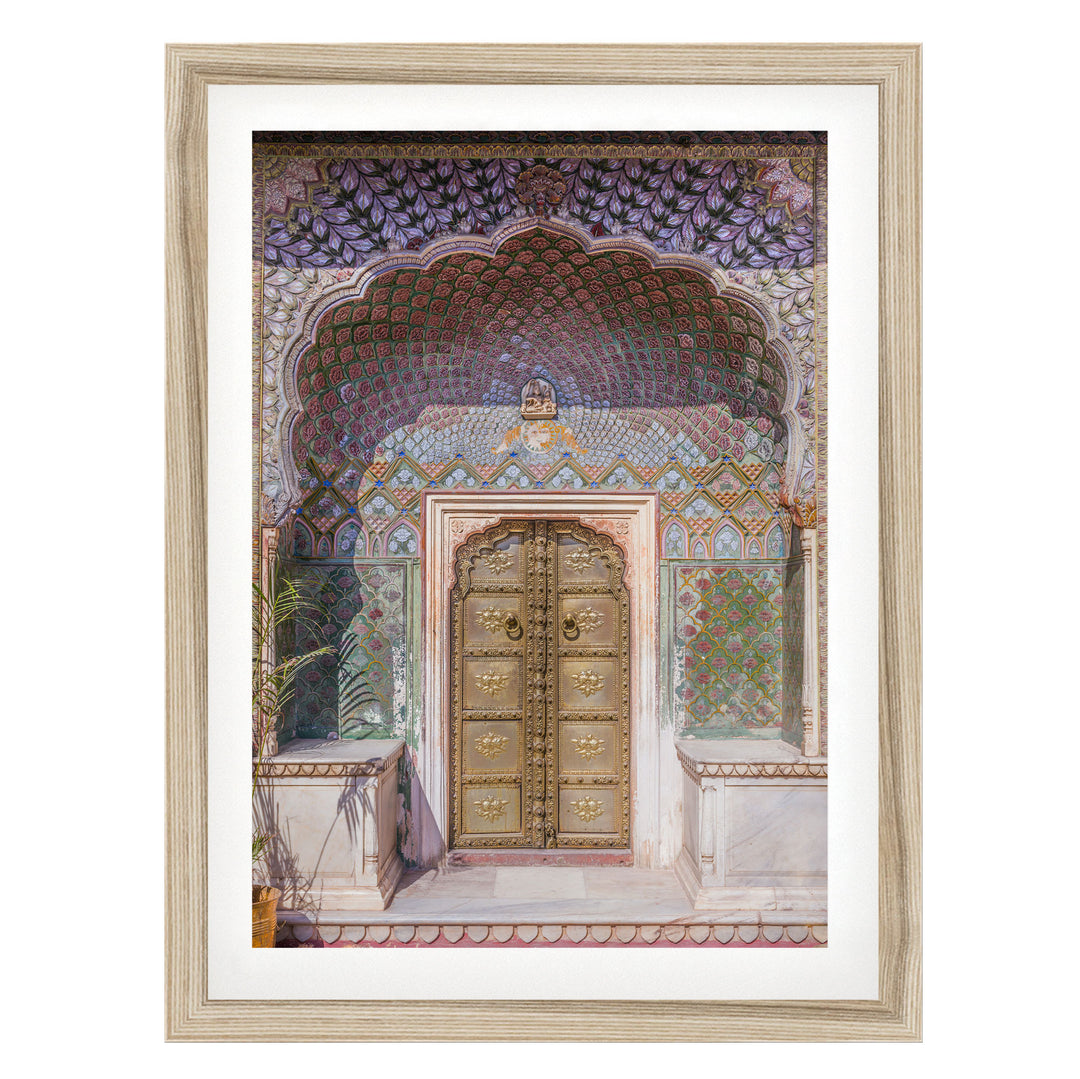 a beautifully decorated doorway with intricate patterns and designs, including a large archway and ornate golden doors.