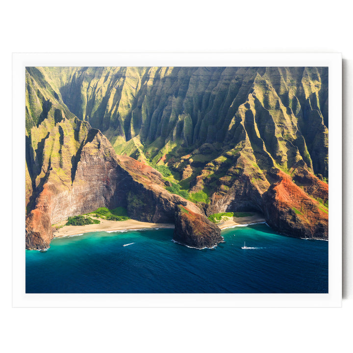 a stunning coastal landscape with towering cliffs, a deep blue ocean, and a sandy beach.