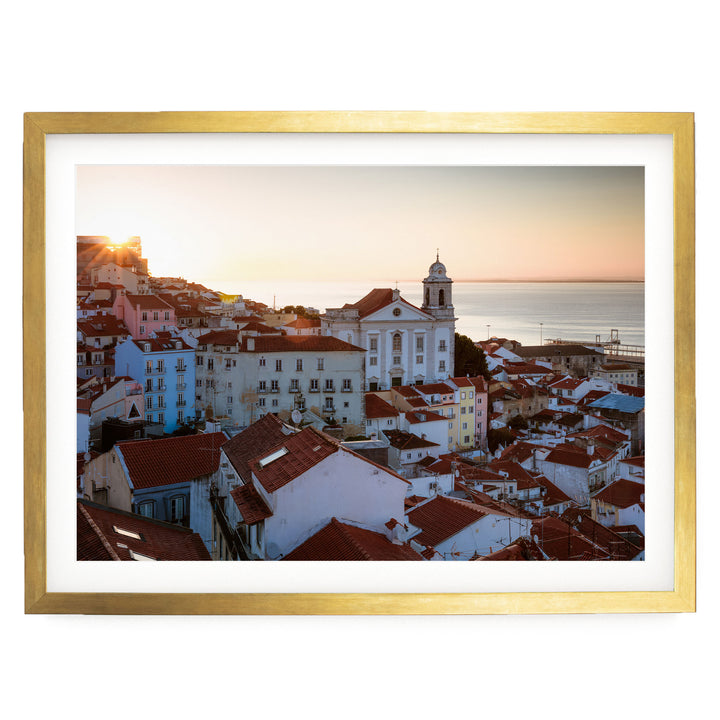 a picturesque cityscape with a church and colorful buildings set against a vibrant sunset sky.