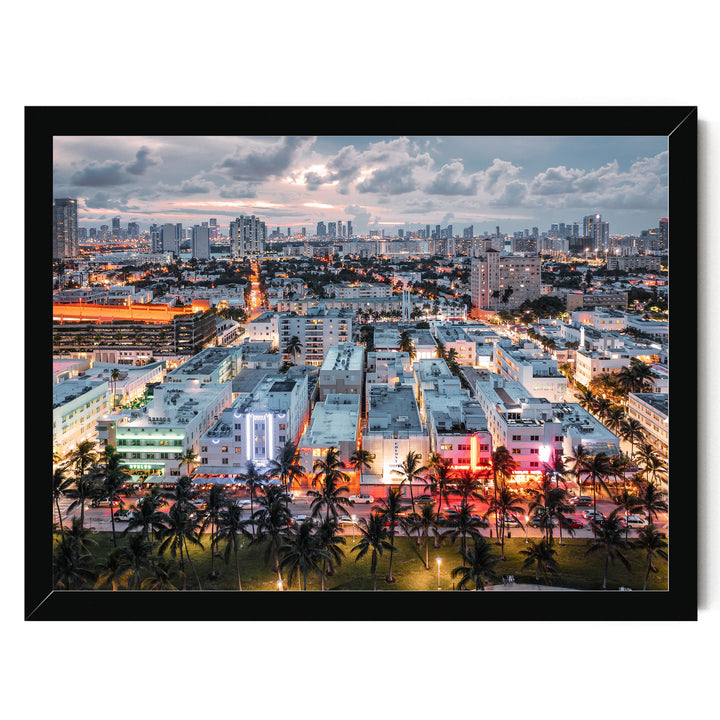 a vibrant cityscape at night, with a skyline of tall buildings illuminated by colorful lights. Palm trees line the streets, adding a tropical touch to the urban landscape.