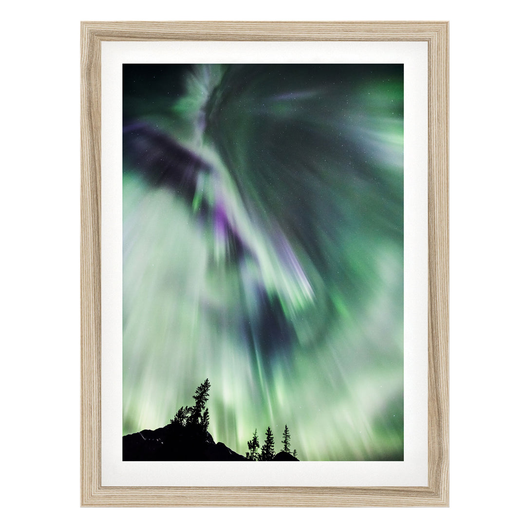 a stunning display of the northern lights, with vibrant green and purple hues swirling across the night sky.