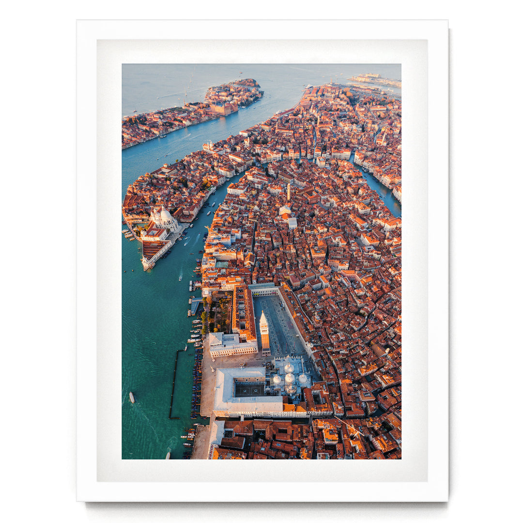 An aerial view of the city of Venice, Italy, showcasing its iconic canals, domes, and buildings.