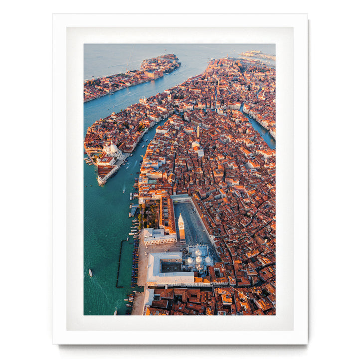An aerial view of the city of Venice, Italy, showcasing its iconic canals, domes, and buildings.
