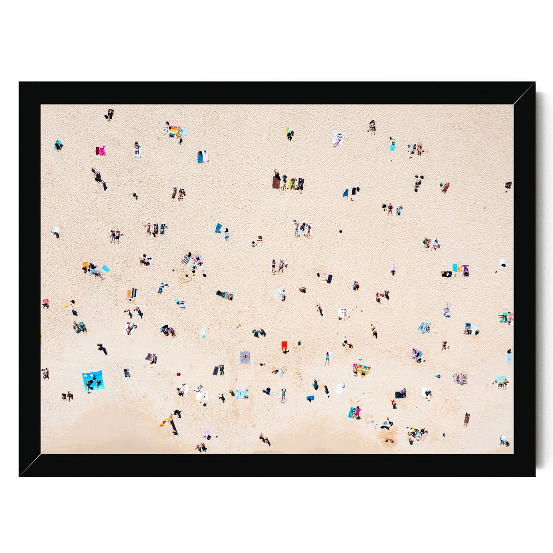The image is a beach scene with many people enjoying the sun and sand.