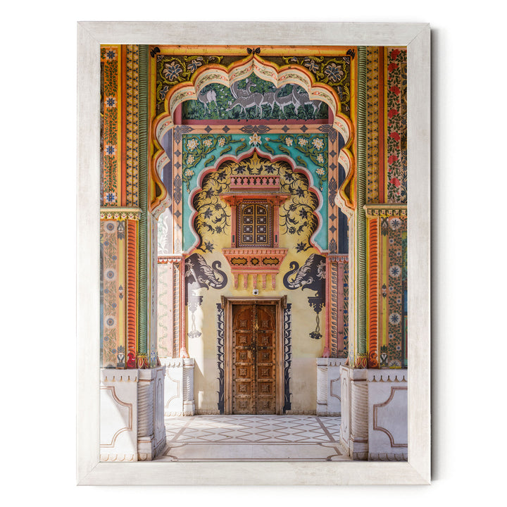 a colorful and ornate doorway with intricate patterns and designs, including a wooden door and decorative columns.