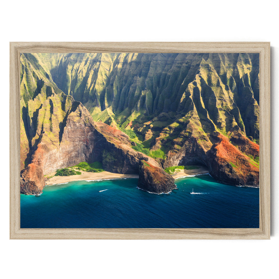 a stunning coastal landscape with towering cliffs, a deep blue ocean, and a sandy beach.
