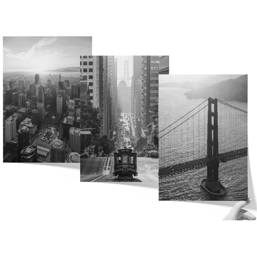 a black and white photo of a city and a bridge