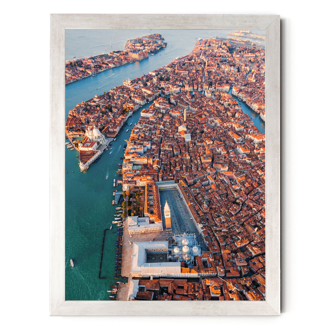 An aerial view of the city of Venice, Italy, showcasing its iconic canals, buildings, and architecture.