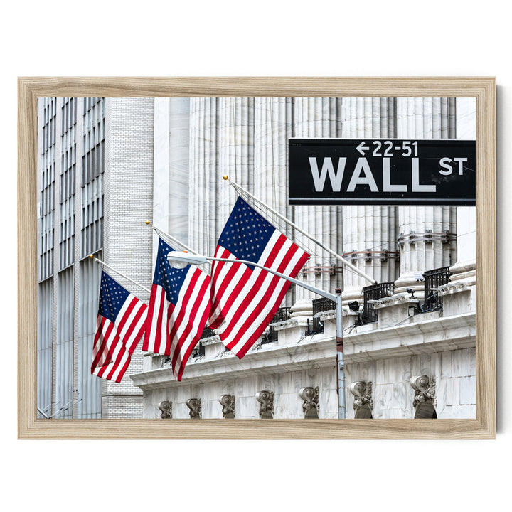 three American flags flying in front of a building with the sign "Wall Street" displayed.