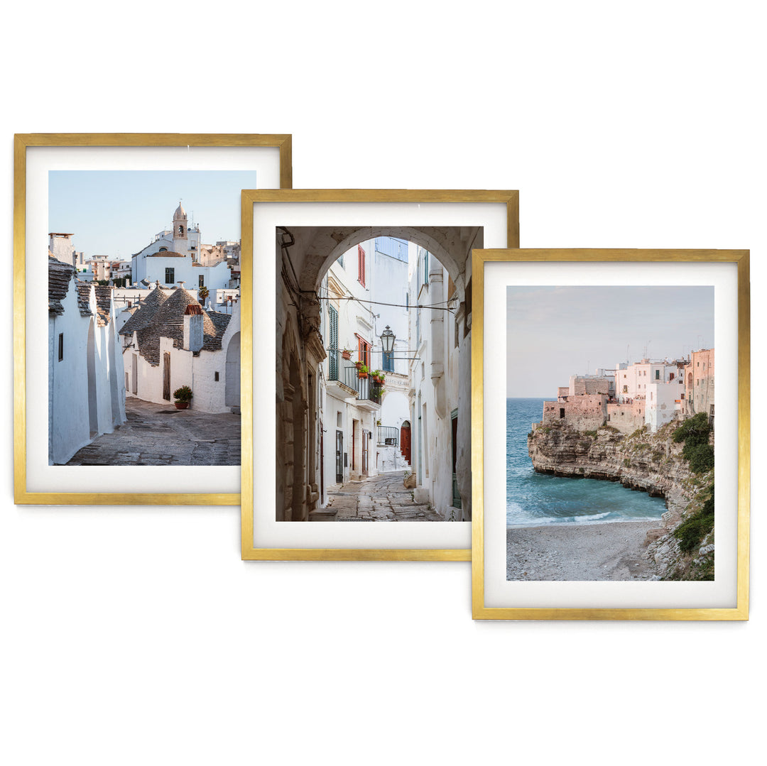 The image is a collage of three framed pictures, each depicting different scenes of a coastal town. The first picture shows a narrow street lined with white buildings, the second picture features a street with a large archway, and the third picture captures a beach with a rocky cliff overlooking the ocean.