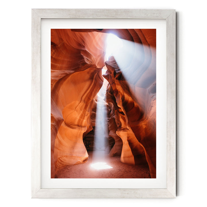 a stunning natural landscape with a narrow passage flanked by towering rock formations, creating a sense of depth and mystery.