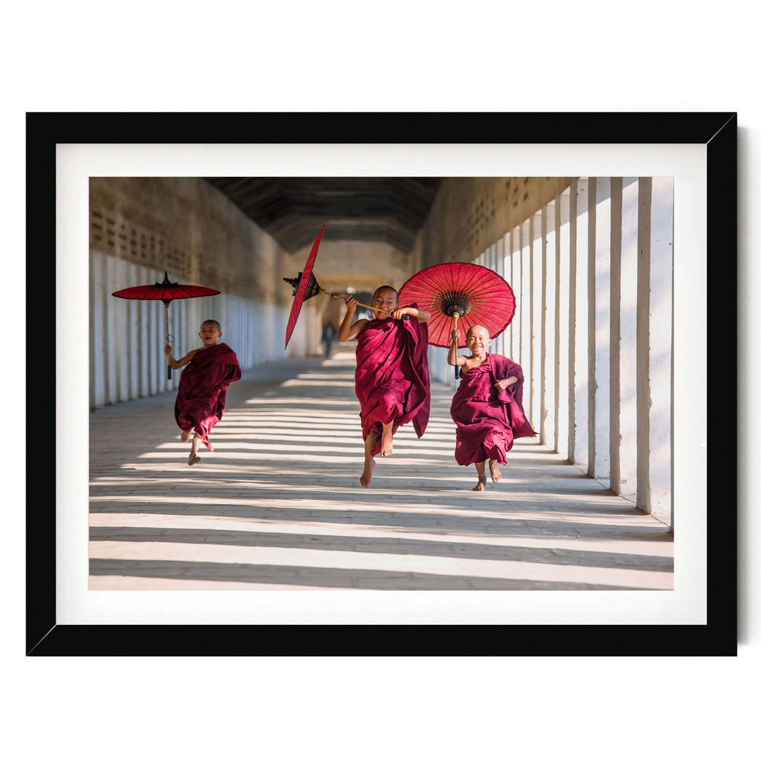 Joyful Monks II, Southeast Asia – fine art print in a black frame with white mat