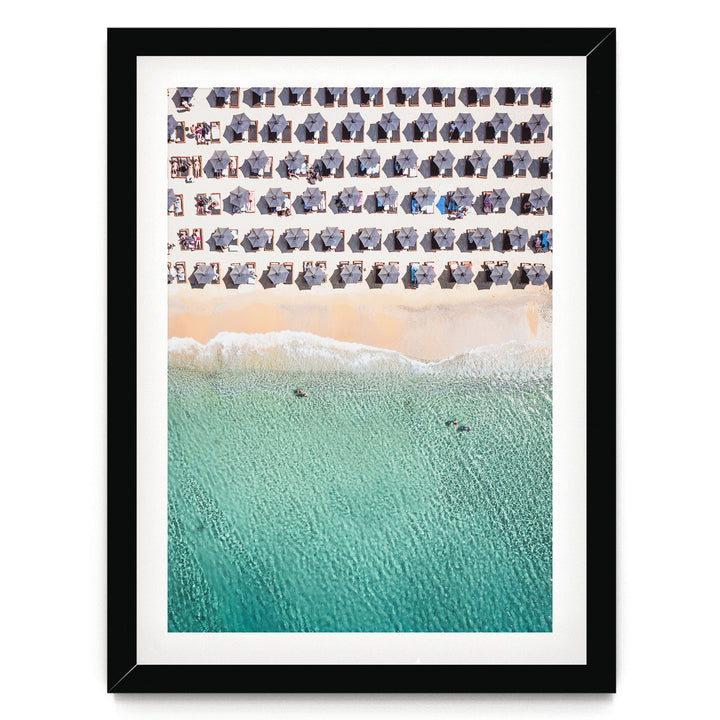 Mykonos Beach II, Elia, Greece – fine art print in a black frame with white mat