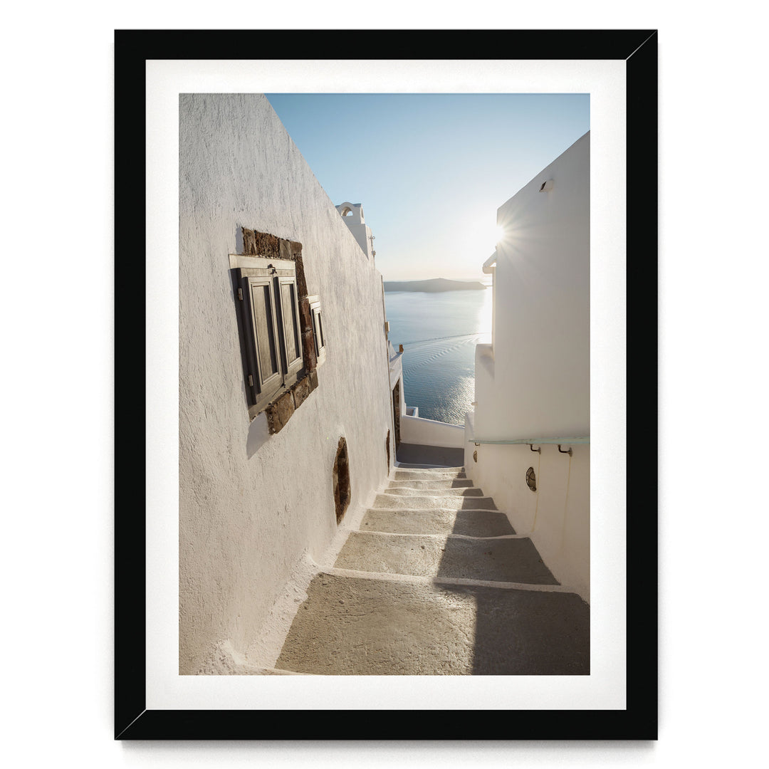 Walking in Oia, Santorini, Greece – fine art print in a black frame with white mat