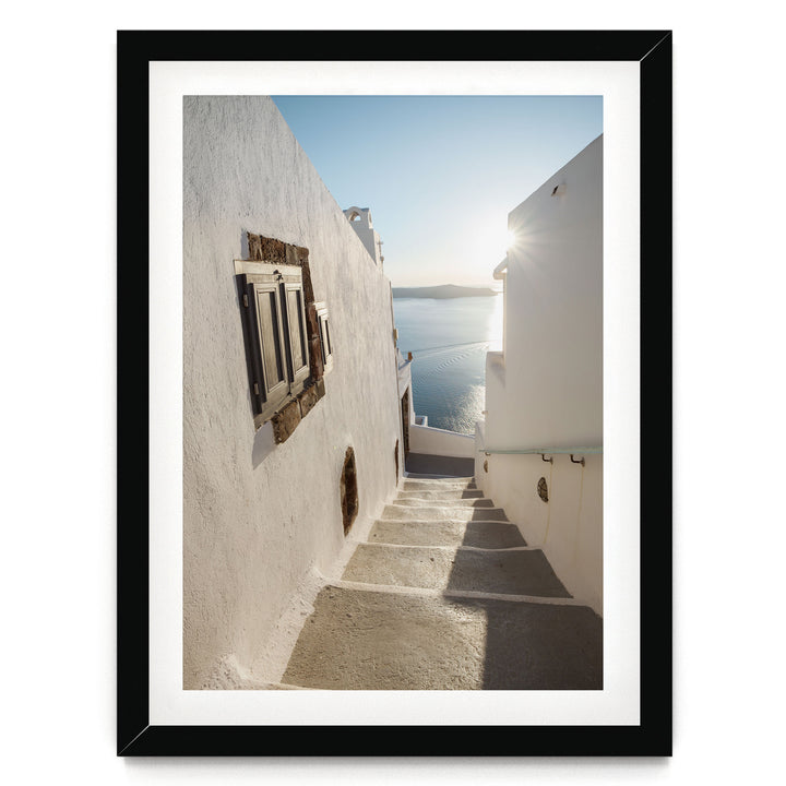 Walking in Oia, Santorini, Greece – fine art print in a black frame with white mat