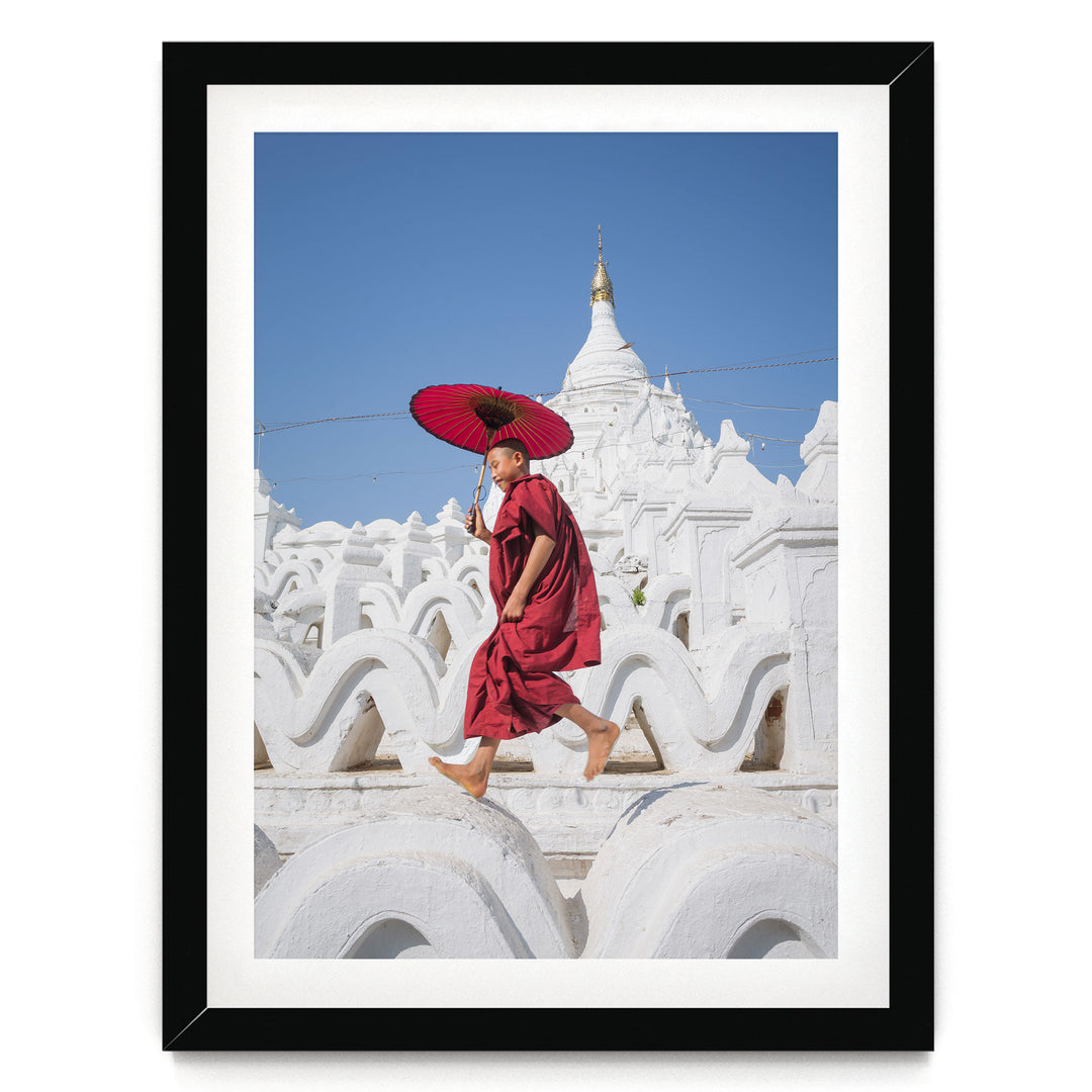 Novice Monk at the Temple, Myanmar – fine art print in a black frame with white mat