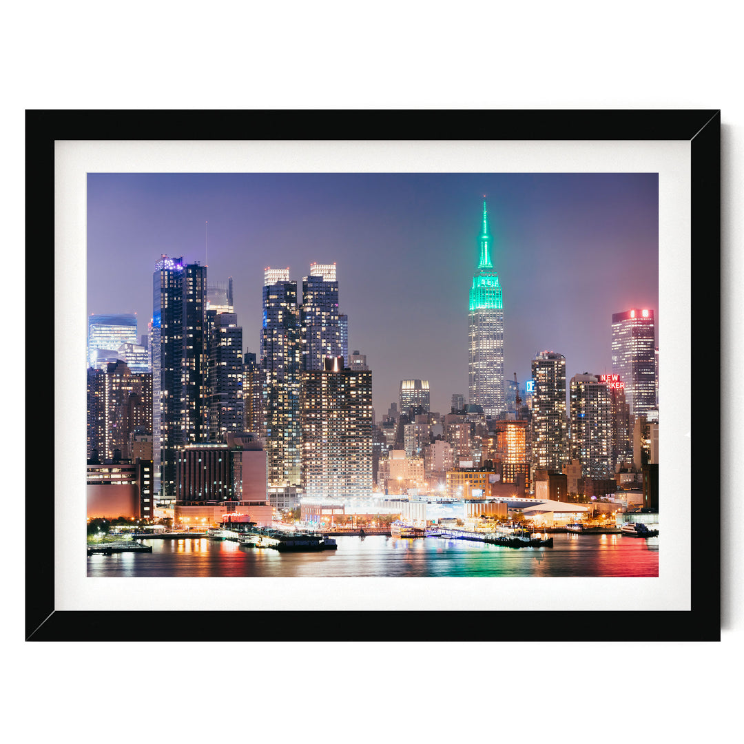 New York Skyline at Night – fine art print in a black frame with white mat
