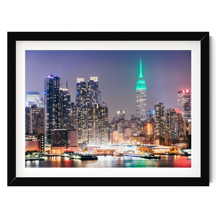 New York Skyline at Night – fine art print in a black frame with white mat