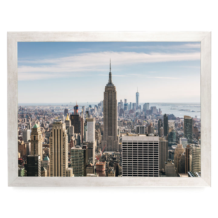 a panoramic view of the New York City skyline, featuring the iconic Empire State Building and other skyscrapers.